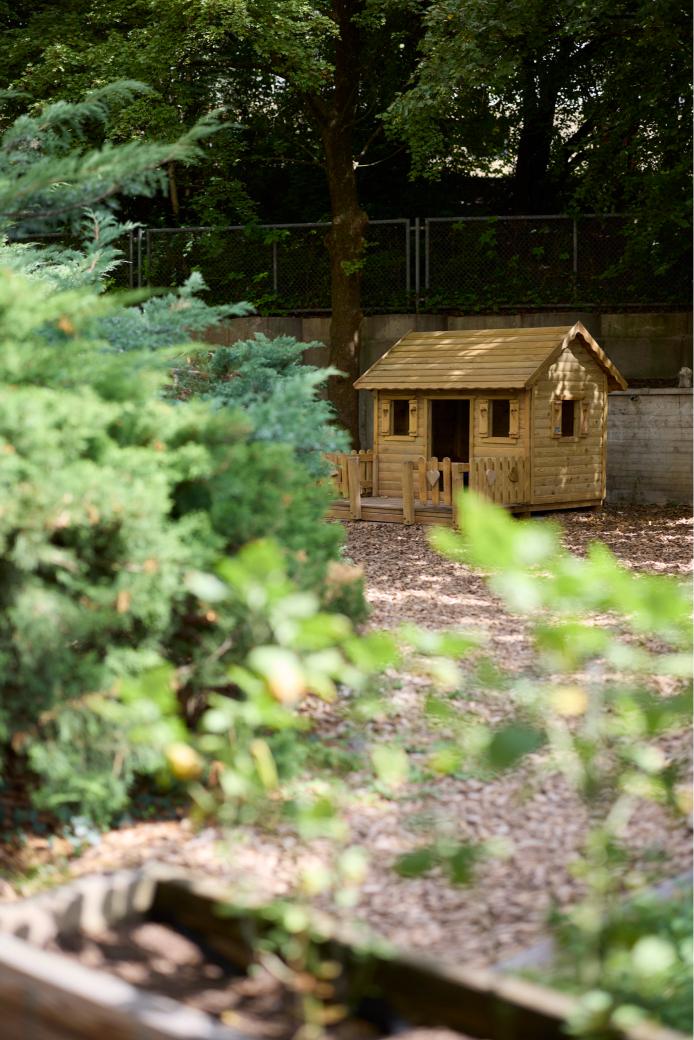 Playhouse made out of wood in the garden